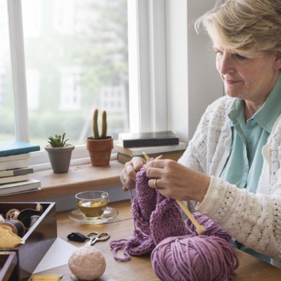 Senior woman knitting